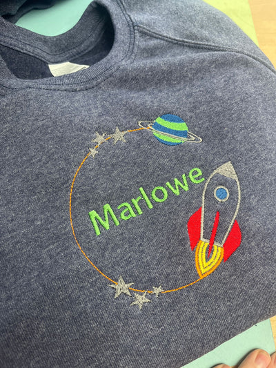 Embroidered personalised rainbow orbit name